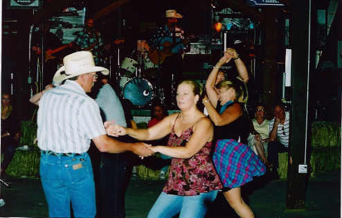 Swing your partner round and round. Greg Pepper, left, dances the night away with partner Bonnie Susuki